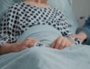 close-up-retired-man-receiving-visit-from-niece-daughter-hospital-ward-little-girl-bringing-flowers-visiting-sick-patient-medical-clinic-giving-support-comfort-recovery_482257-32286