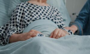 close-up-retired-man-receiving-visit-from-niece-daughter-hospital-ward-little-girl-bringing-flowers-visiting-sick-patient-medical-clinic-giving-support-comfort-recovery_482257-32286